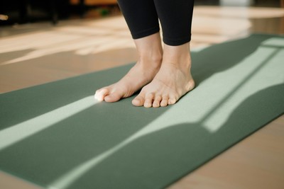 A person doing yoga online at Threepoint Massage & Yoga Therapy in Millarville, AB